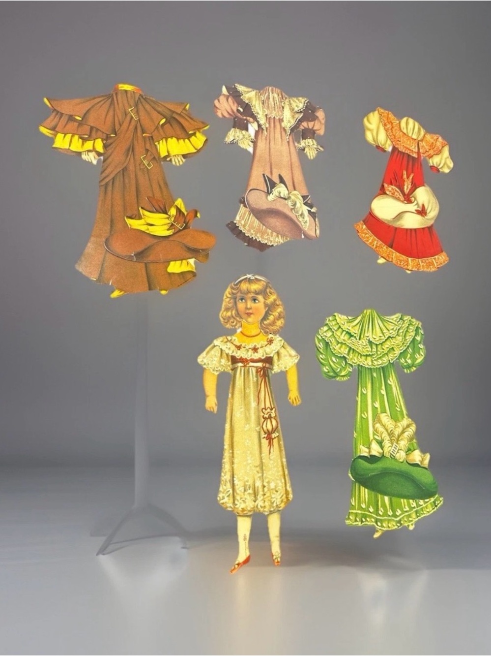 Tucks Vintage Paper Doll with Assorted Dresses - Yellow, Brown, Green, Red